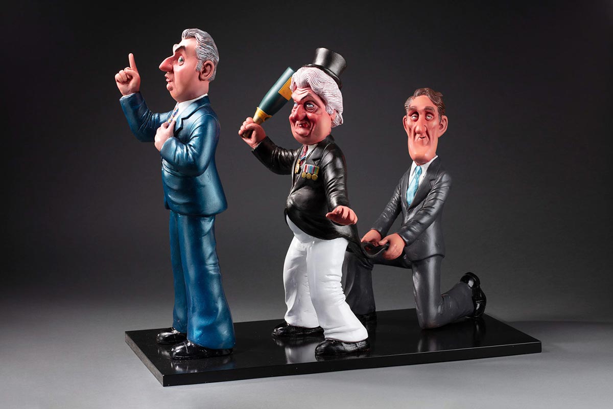 Three-dimensional comical figures of Opposition Leader Malcolm Fraser, Governor General Sir John Kerr, and Prime Minister Gough Whitlam mounted on a black base. - click to view larger image