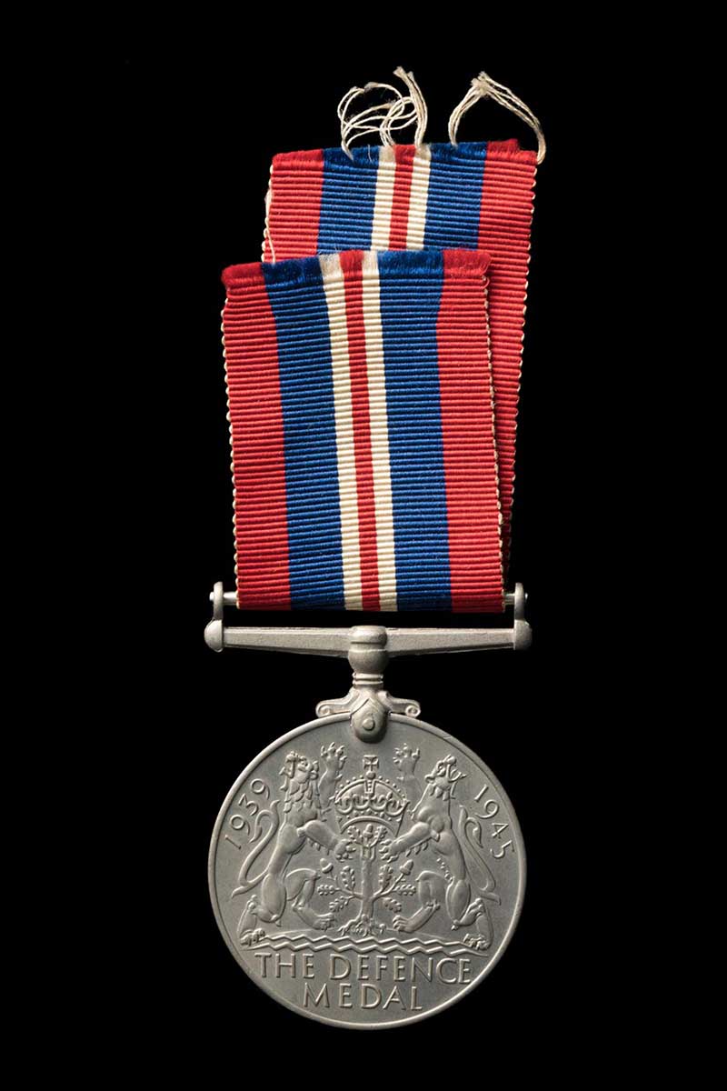 medal with red white and blue ribbon on a black background - click to view larger image