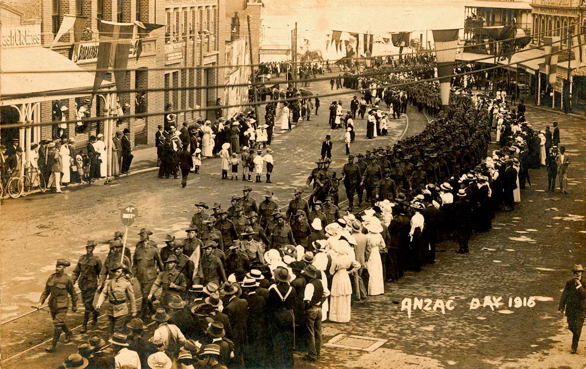 Men, women and children line the streets in Brisbane to watch a procession.