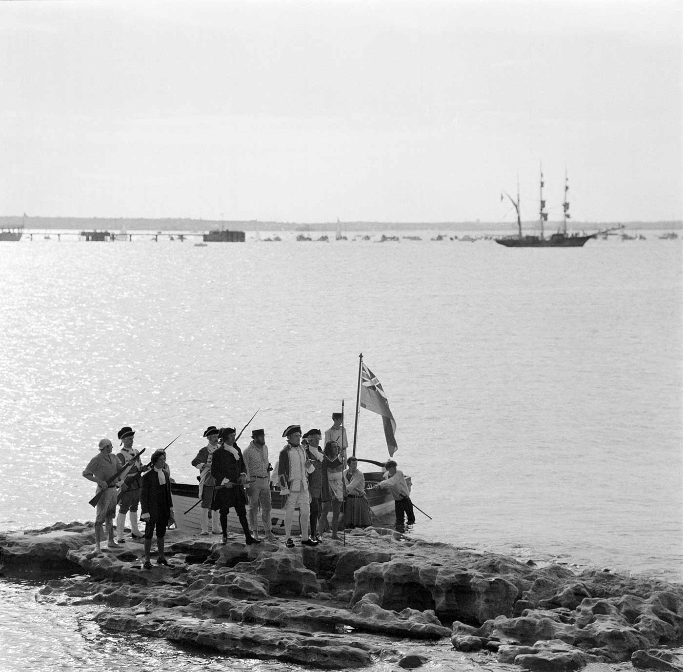 Black and white photo of a group of people as part of the re-enactment of Captain Cook's landing, Kurnell, 1970.  - click to view larger image