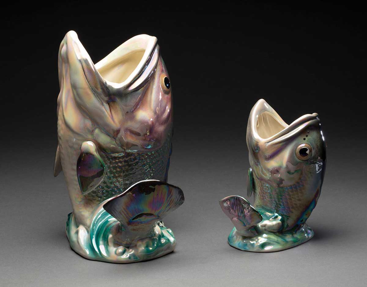 Two ceramic vases in the shape of Dhufish jumping through waves.  - click to view larger image