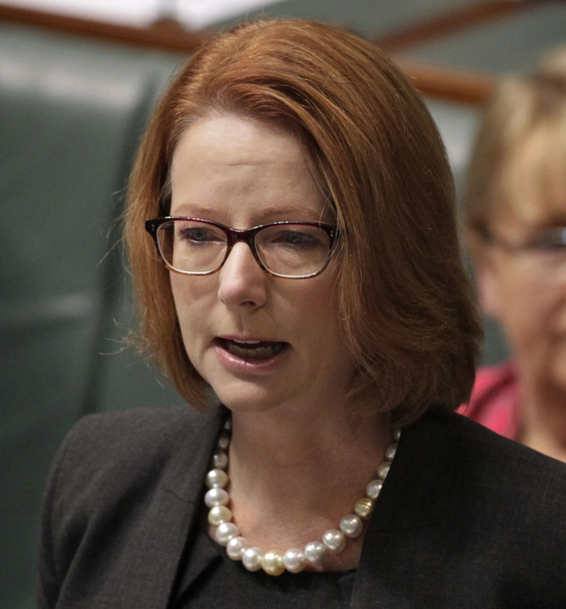 Julia Gillard who appears quite emotional addresses the chamber at Parliament House. - click to view larger image
