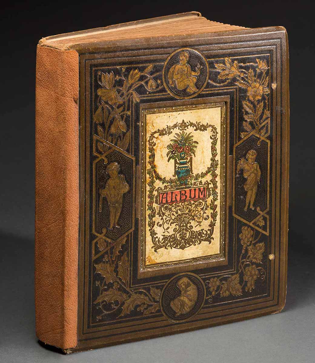 Album with ornate cover. - click to view larger image