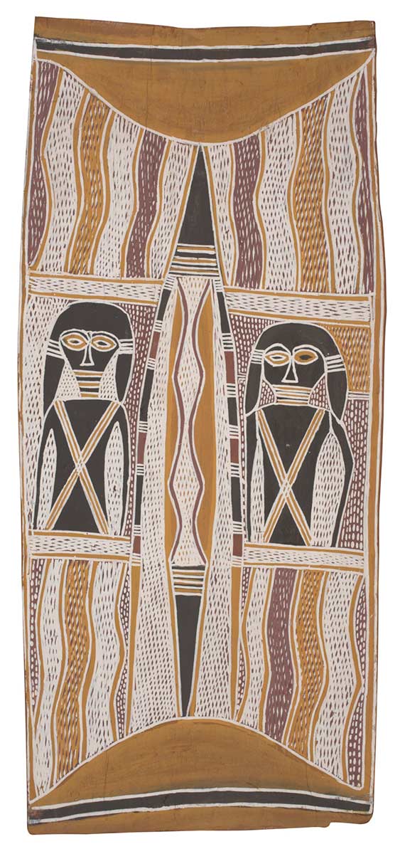 A bark painting worked with ochres on bark. It depicts a central digging stick with a female ancestral figure on either side of this. At either end of the painting there are  semi-circular yellow forms and the background consists of lines of purple, white and yellow crosshatching. - click to view larger image