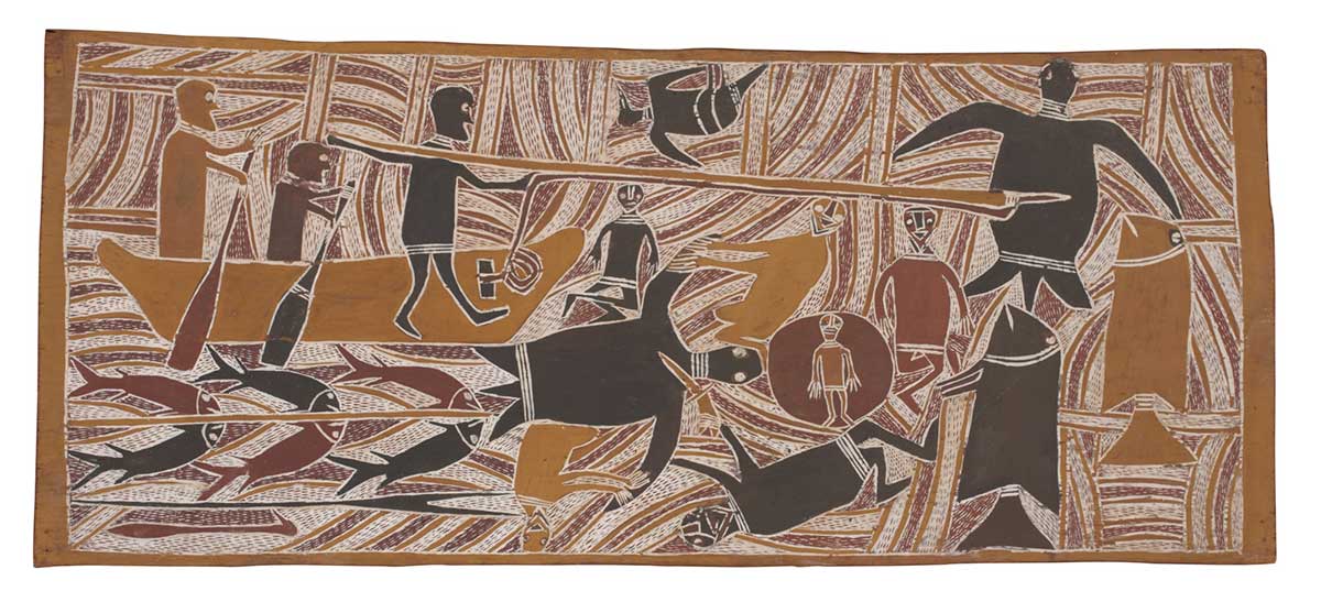 A bark painting worked with ochres on bark. It depicts three men in a boat, two holding paddles and one with a harpoon aimed at a large turtle. There are two large fish below the turtle. Beneath the boat there are six small fish shown beside two spears. Beside this five men and a child are butchering a a large turtle. At the centre top of the painting there is a bird. - click to view larger image