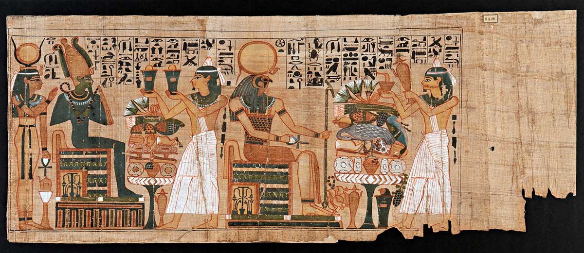 Scroll depicting five Egyptian figures, three of which appear to be in servitude of the other two. Hieroglyphics run along the top section and the edges on the right hand side is tattered.