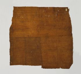 Thin single-layered barkcloth with an orange-ochre colour, decorated with parallel red lines on one side.