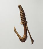 Fishhook with a wooden shank, bone point and lashing of twisted cords of plant material.