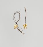Pair of ear ornaments each composed of three pearls, tied together with plaited human hair.