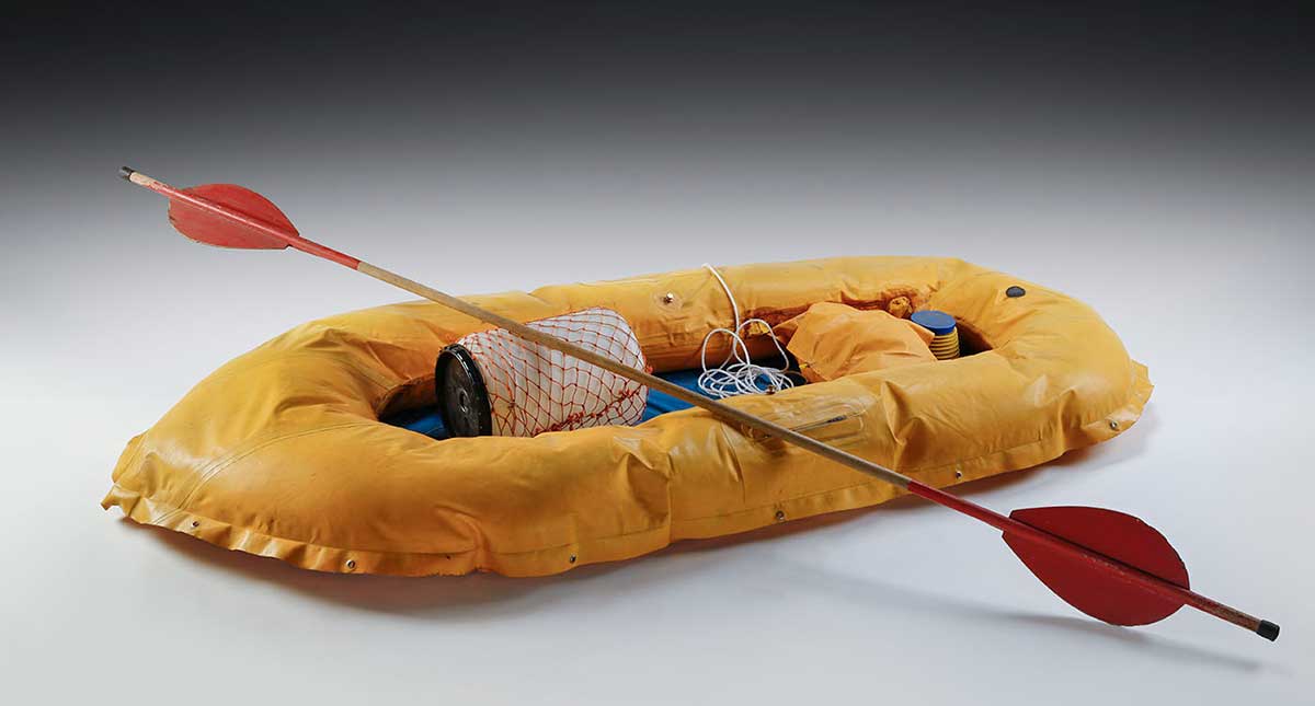 studio photo of a raft with a paddle.