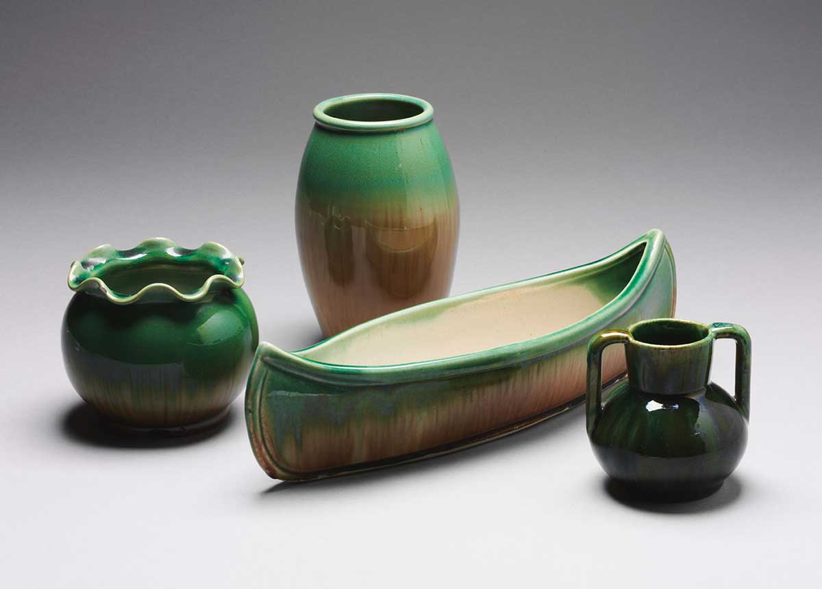 Assortment of green and fawn glazed Waverley ware vases produced between 1925 and 1950.