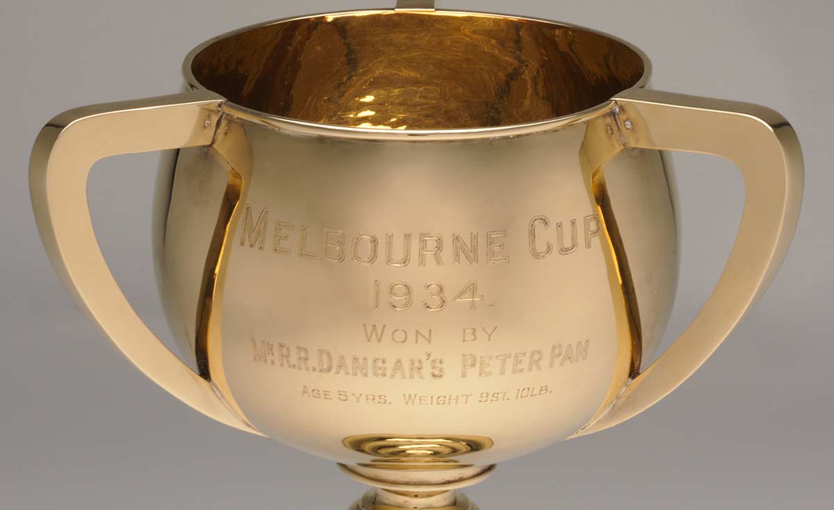 Detail showing inscription on front of a gold cup. - click to view larger image