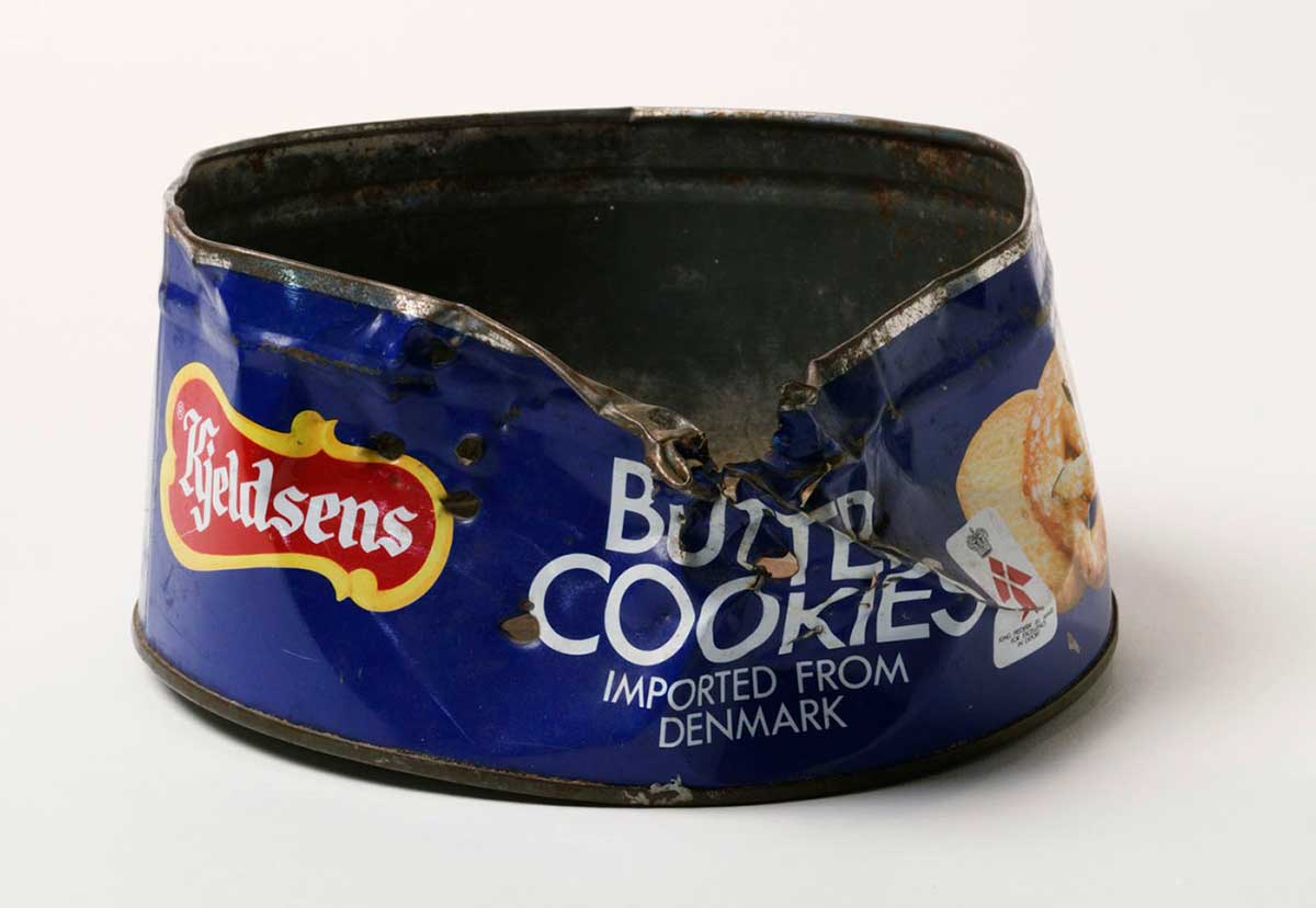 Round 'Butter Cookies' biscuit tin with damage to rim and side. - click to view larger image
