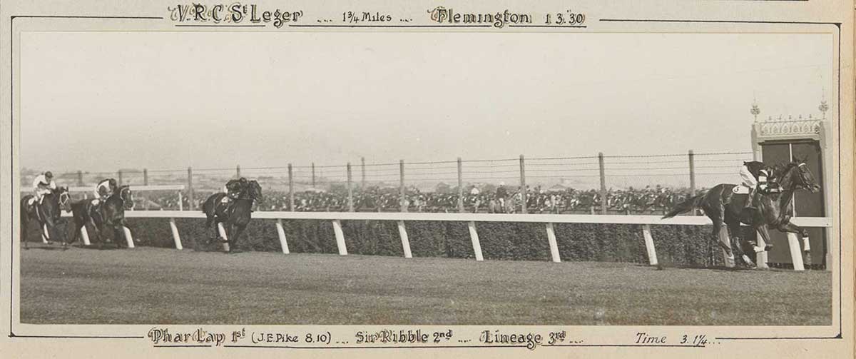 A black and white photo of Phar Lap winning the VRC St Leger. - click to view larger image
