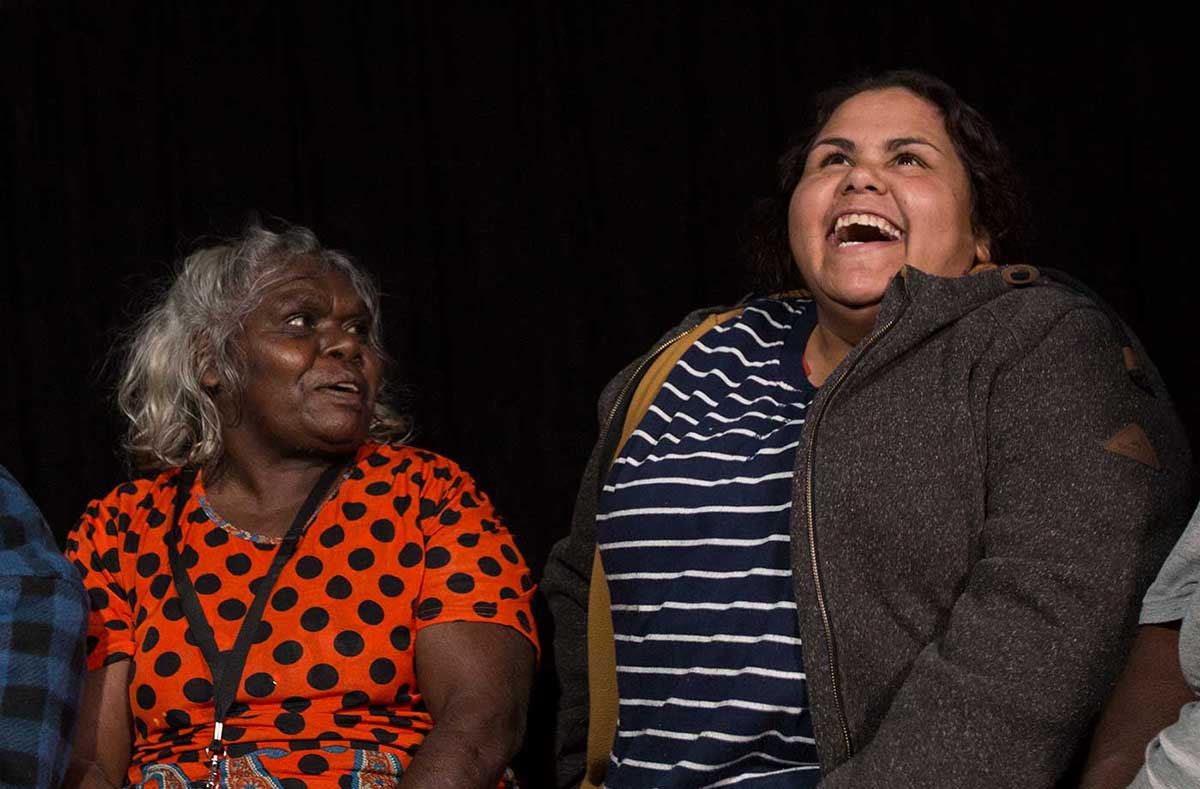 Elderly woman and young woman laughing. - click to view larger image