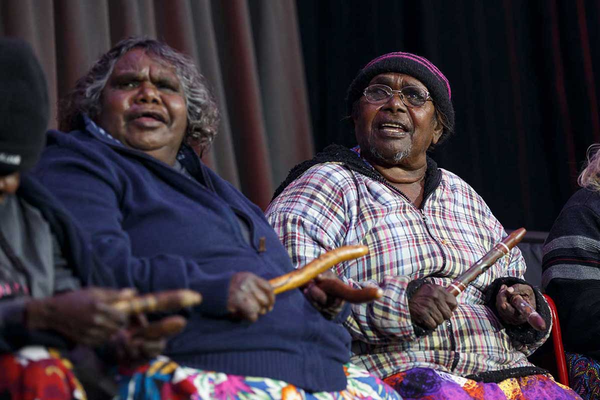Josephine Mick and Pantijiti McKenzie with wooden clap sticks. - click to view larger image