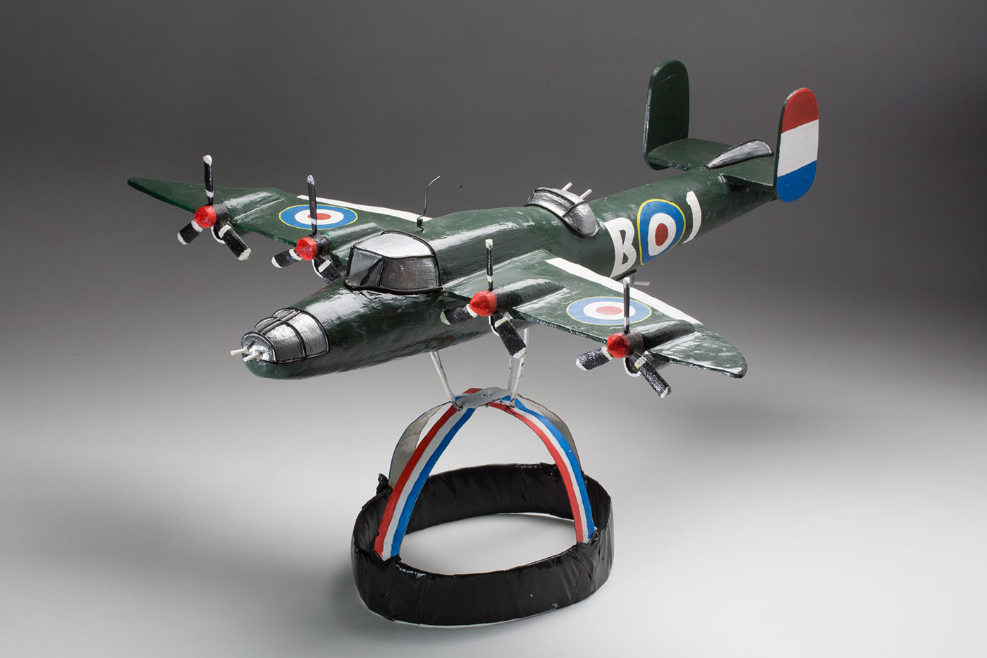 Model of a British carrier plane attached to a headdress - click to view larger image