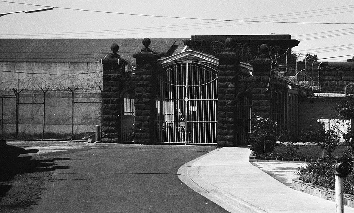 Black and white photo of the exterior of a prison.