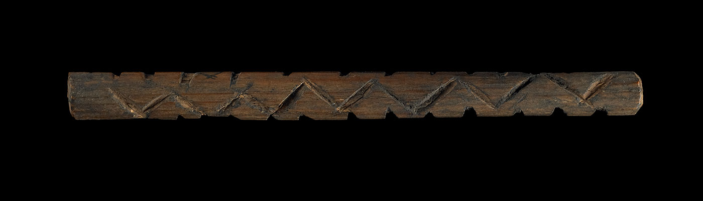 Message stick made of wood (pine), charcoal, emu (fat).