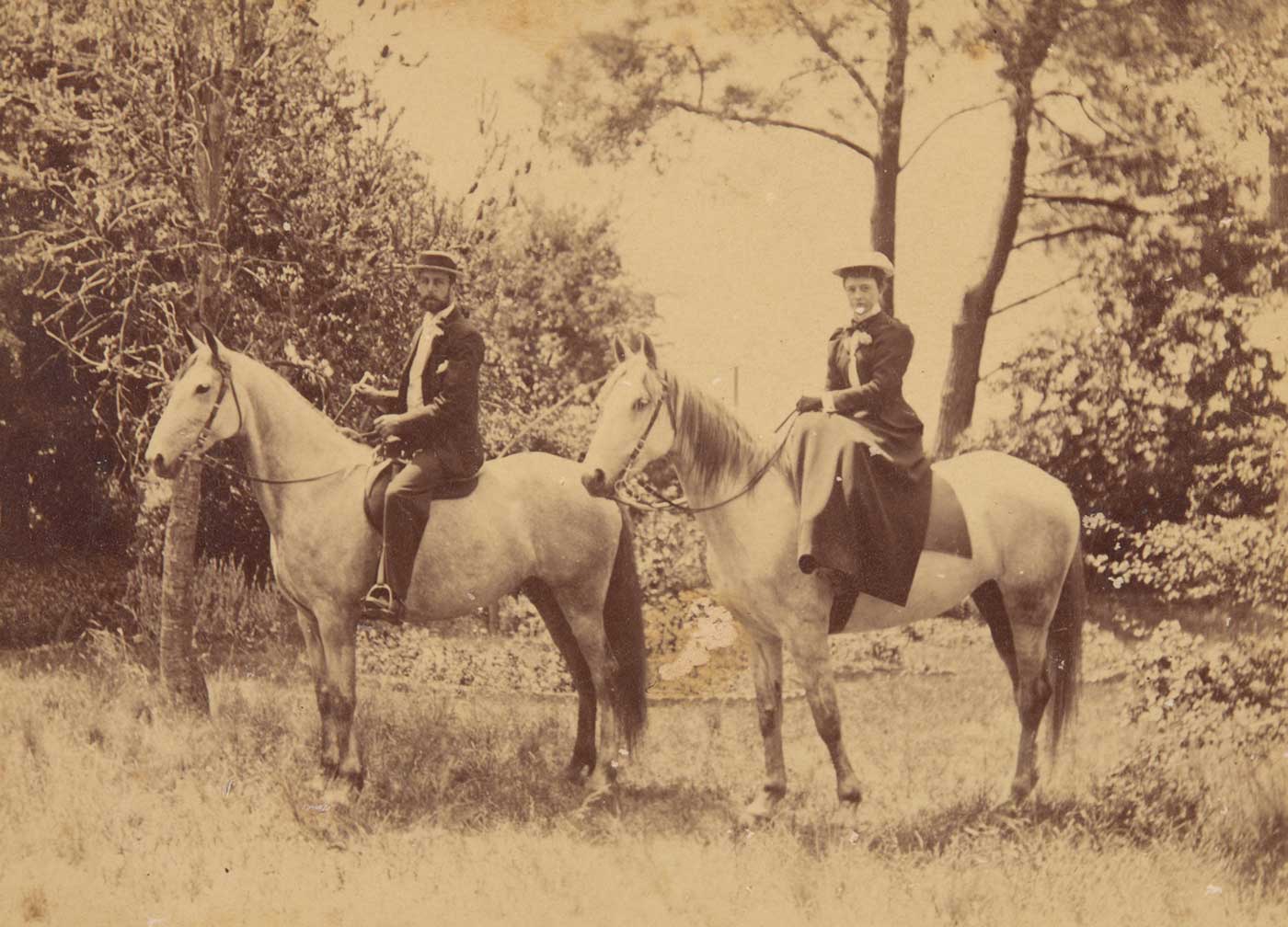 A black and white photograph that depicts William Hugh Anderson and Frances Lilian Faithfull mounted on light-coloured horses. - click to view larger image