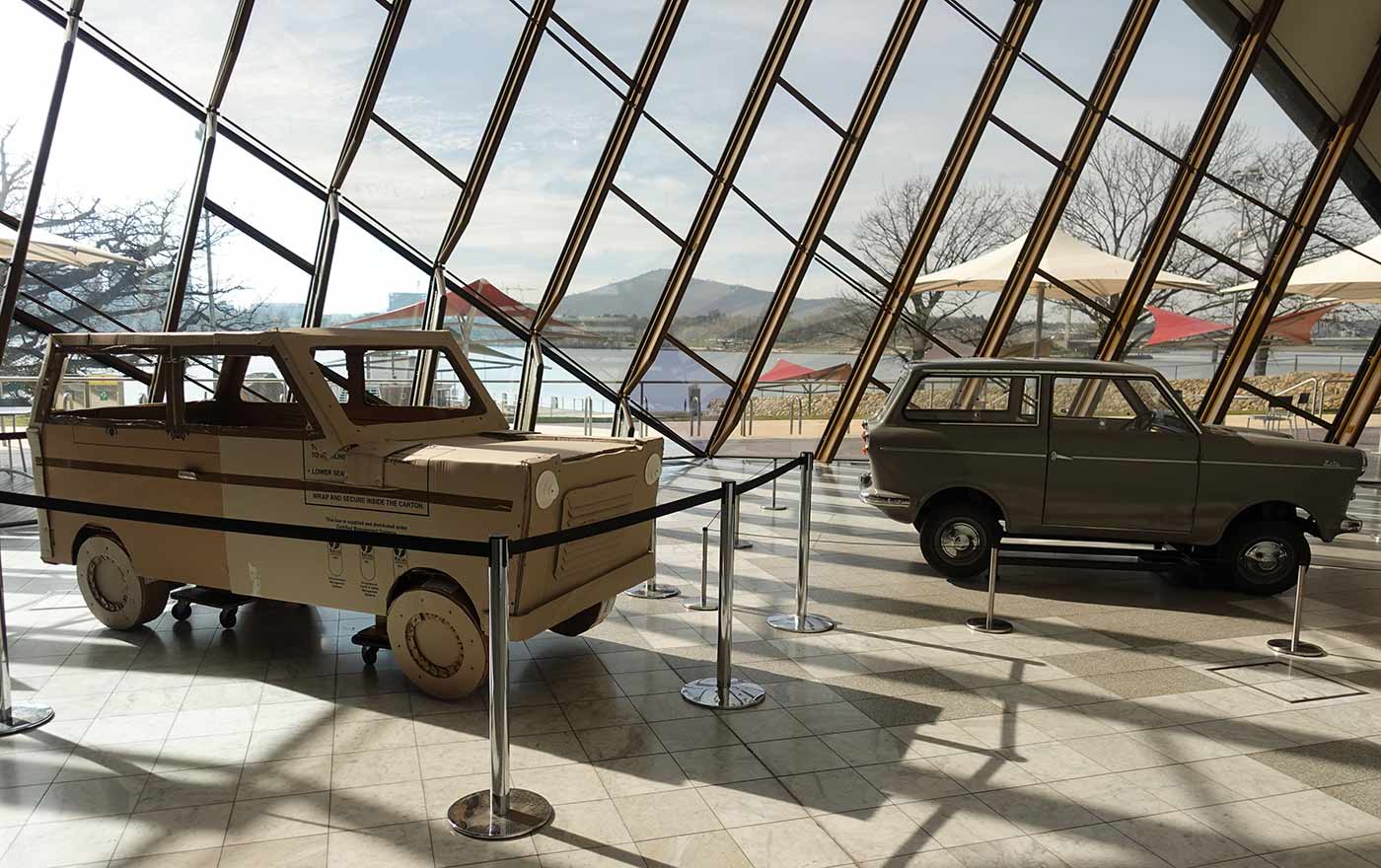 Zeta car model and a cardboard representation of it on display in the Gandel Atrium at the National Museum of Australia.