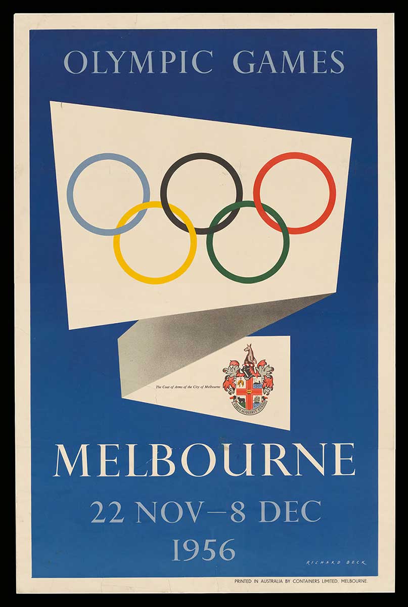 A poster bearing the text 'OLYMPIC GAMES / MELBOURNE / 22 NOV - 8 DEC / 1956' on a blue background. The poster also features a white folded scroll containing the Olympic ring symbol and the coat of arms of the City of Melbourne. The poster is mounted on a backing.