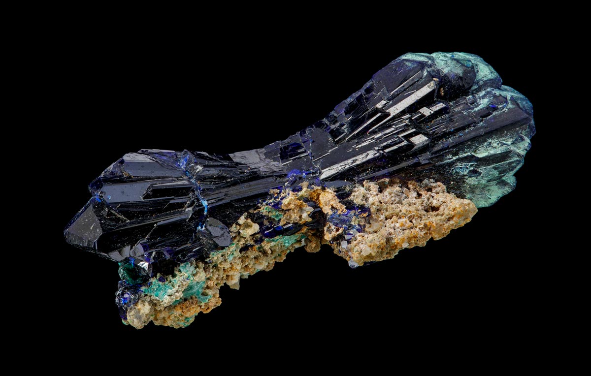 A mineral specimen of predominantly black crystals. - click to view larger image