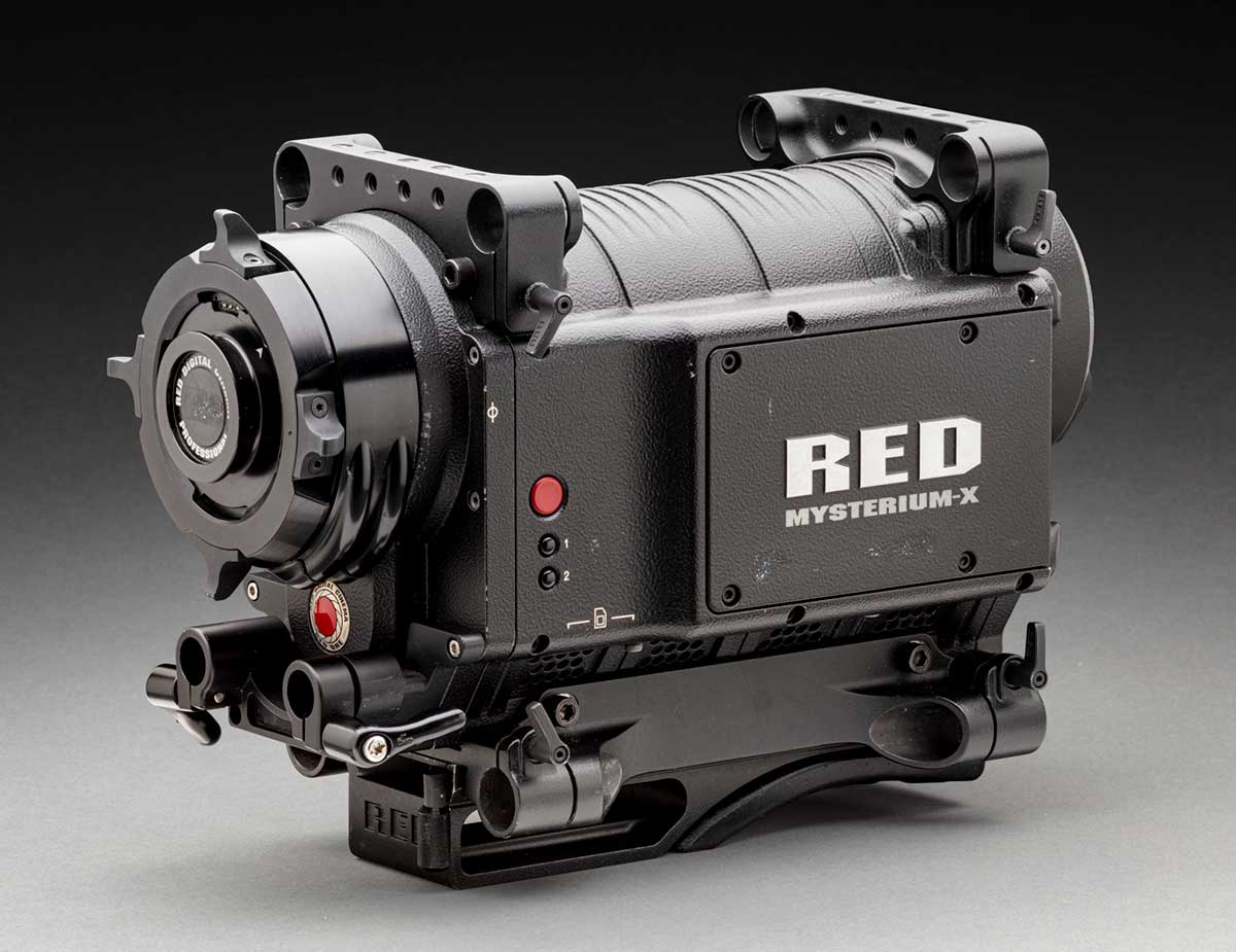 A black camera with a digital display at one end and a lens at the other. Embossed in silver on one side is 'RED / MYSTERIUM-X'. - click to view larger image