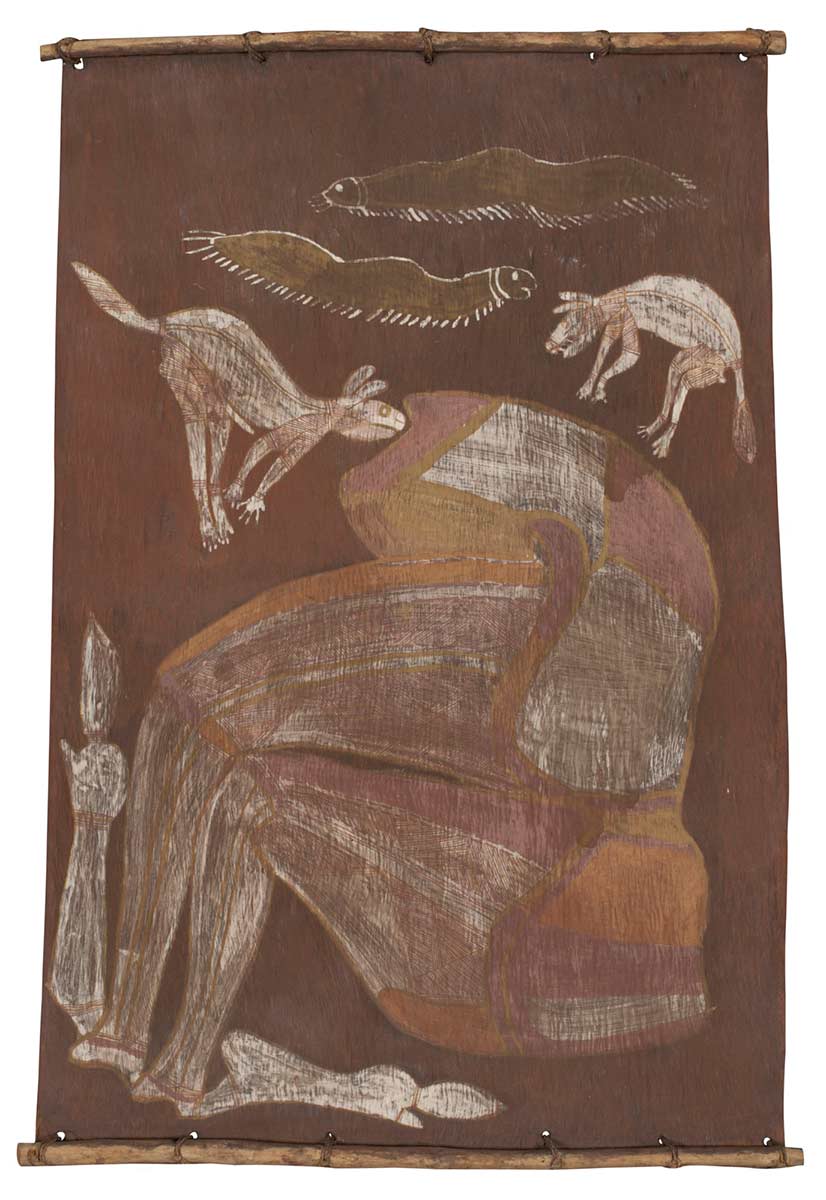A bark painting worked with ochres on bark and on wooden restrainers. It depicts the legs and body of a wallaby with two dingores and two maggots. The dingoes have been painted as pipeclay silhouettes and infilled with red ochre crosshatching and x-ray detail showing their backbones.The maggots are painted in a thin wash of yellow ochre and outlined in pipeclay. The wallaby shows faint infilling with red ochre crosshatching over a thin pipeclay wash and blocks of varying shades of red and orange ochre wash in blocks. The legs have been broken at the knee joints and partially severed. The background of the painting is brown. - click to view larger image