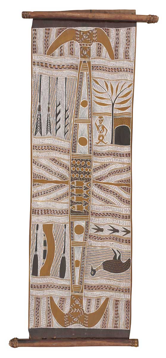 A bark painting worked with ochres on bark and with wooden restrainers. The painting has a central elongated shape with four fish in the middle section and anchor like shapes at either end. There are four fishing spears on the upper left side with the panel to the right of this showing a seated human figure, a tree and a small dwelling. In the lower left there are two fishing paddles and in the panel to the right a bird with three bird footprints. The painting has a black border at either end. - click to view larger image