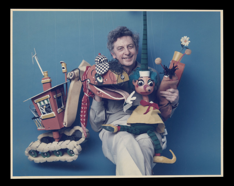 A old faded colour photograph of Norman Hetherington with Bill Steamshovel, Mr Squiggle and Gus the Snail.