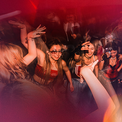 A photo of people dancing at a party at the Museum.