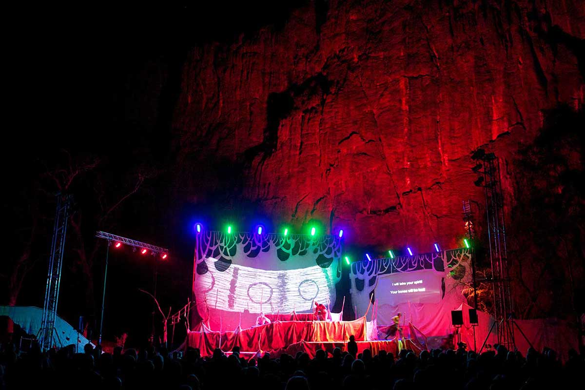 A stage with lights, set in a rocky landscape. - click to view larger image