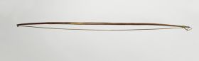 Long bow, made of brown wood. A strong cord made of three twisted strings made of hibiscus fibre, attached as a bowstring.