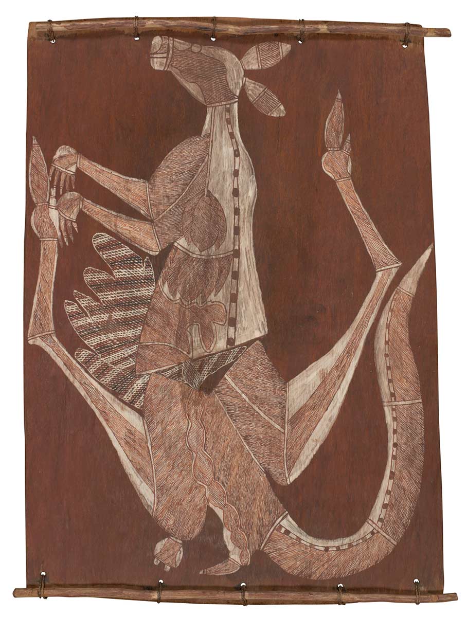 A bark painting worked with ochres on bark and on wooden restrainers. It depicts a male plains kangaroo painted as a pipeclay silhouette. This is infilled with cross hatching and x-ray detail depicting the heart, lungs, backbone, liver and other parts of the intestinal tract. The painting has a brown ochre background. - click to view larger image