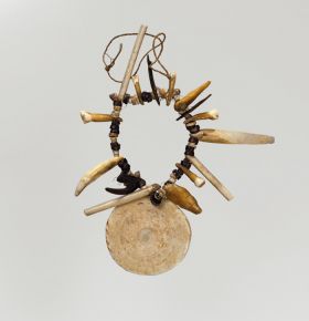 Necklace made from shell, coconut shell, tortoiseshell, bone and teeth.