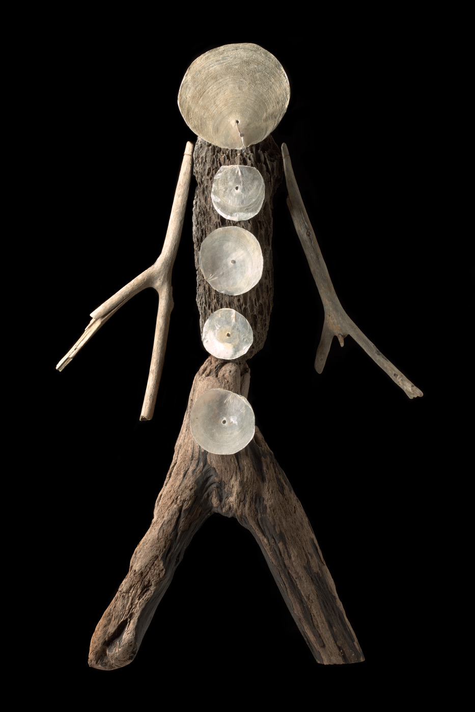 A figurative artwork made from driftwood, pearl shell and copper wire. - click to view larger image