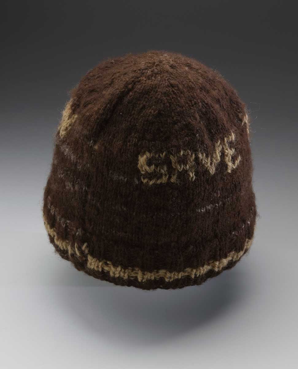 A brown hand-knitted woollen beanie with a camel-coloured stripe around the brim and the words ‘Save the Franklin’ knitted into the surface. The beanie also has grey mottled wool throughout the brown wool. - click to view larger image