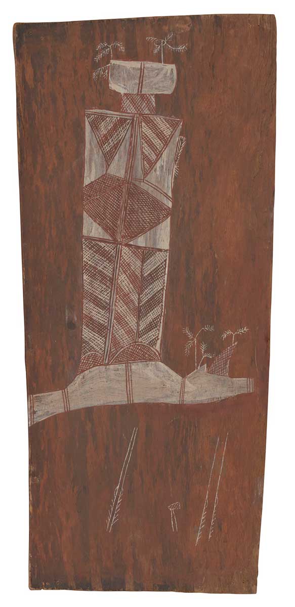 A bark painting worked with ochres on bark. It depicts a vertical rectangular shape with a smaller crosshatched horizontal rectangle on top of this and a larger white painted rectangle above this again. There are three feathery white trees attached to this. The main rectangle has patterns of cross hatching with triangular pattterns in white. Below this is an irregular white painted shape divided by bands of red. A further three feathery trees are depicted here beside a crosshatched thorn shape.  Below this image are four spears and an axe all painted white. - click to view larger image