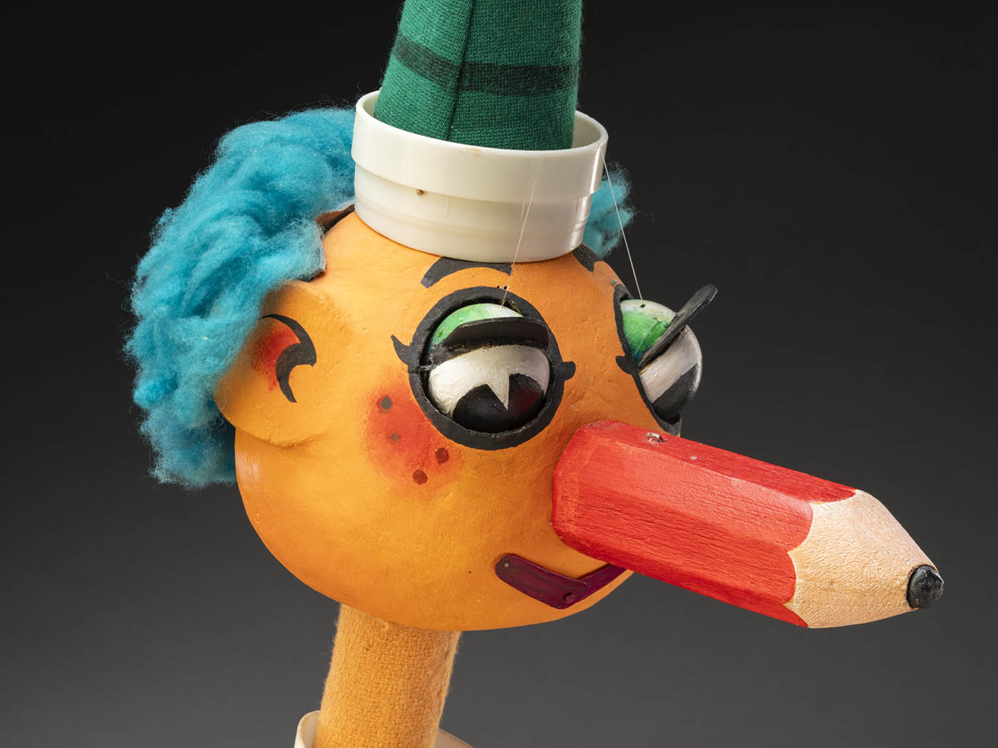 A close up of Mr Squiggles face showing his pencil nose.
