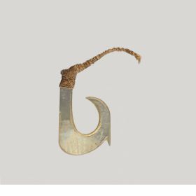 Fishhook made of mother-of-pearl with a straight shank and a barb located on the outer side of the hook, directly below the point.