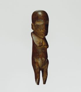 Flywhisk handle made of ironwood formed into a human-like shape.