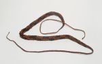 Rope made of reddish-brown and blackish-brown coconut fibre cords plaited together several times.