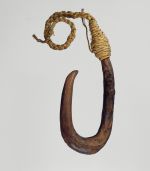 U-shaped fishhook made from a piece of hardwood made secure with cord.