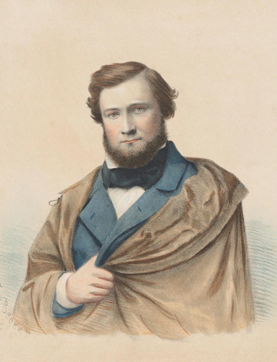 Colour image of bearded man wearing cloak concealing his missing left arm. - click to view larger image