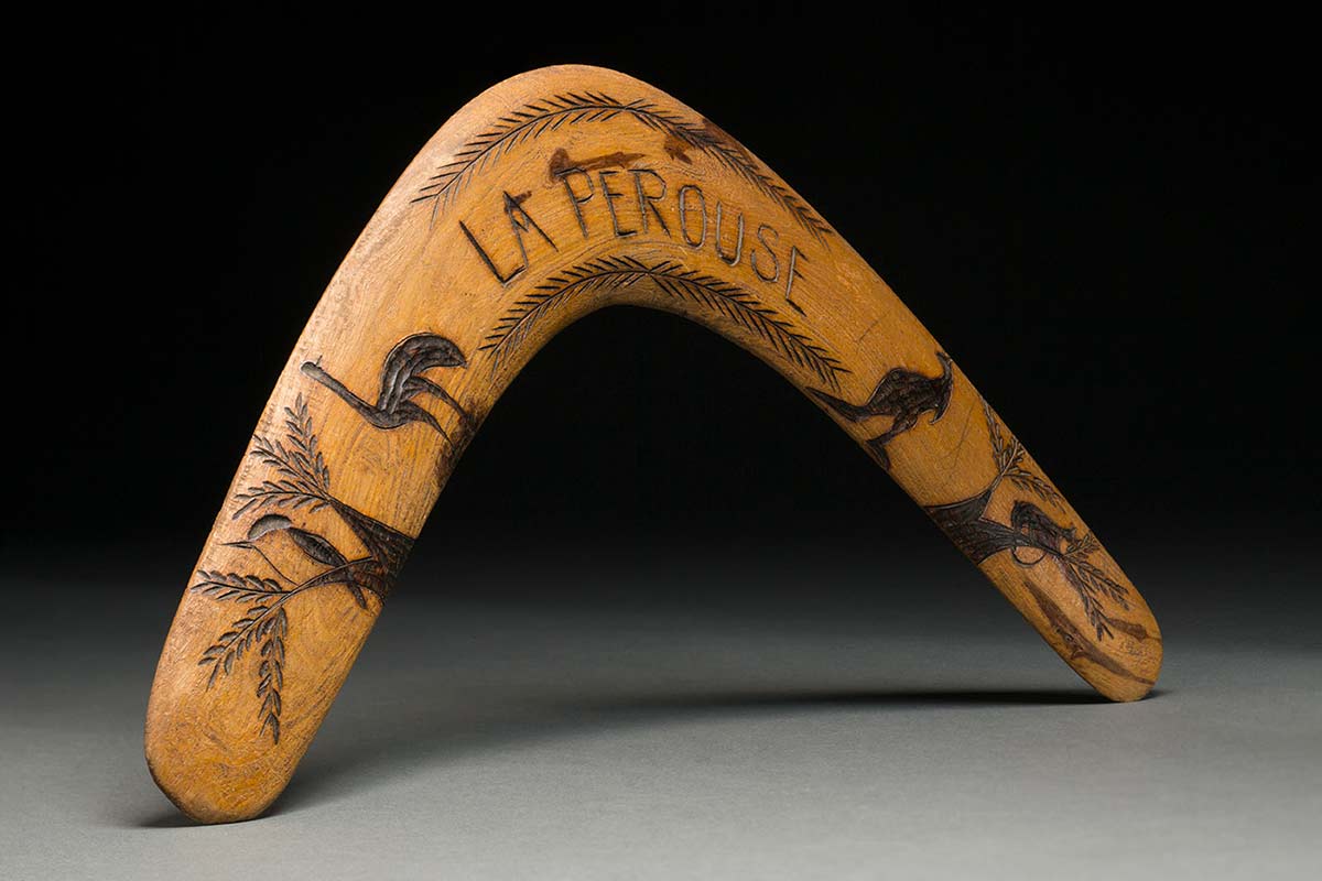 Light timber boomerang from La Perouse decorated with Indigenous animals.
