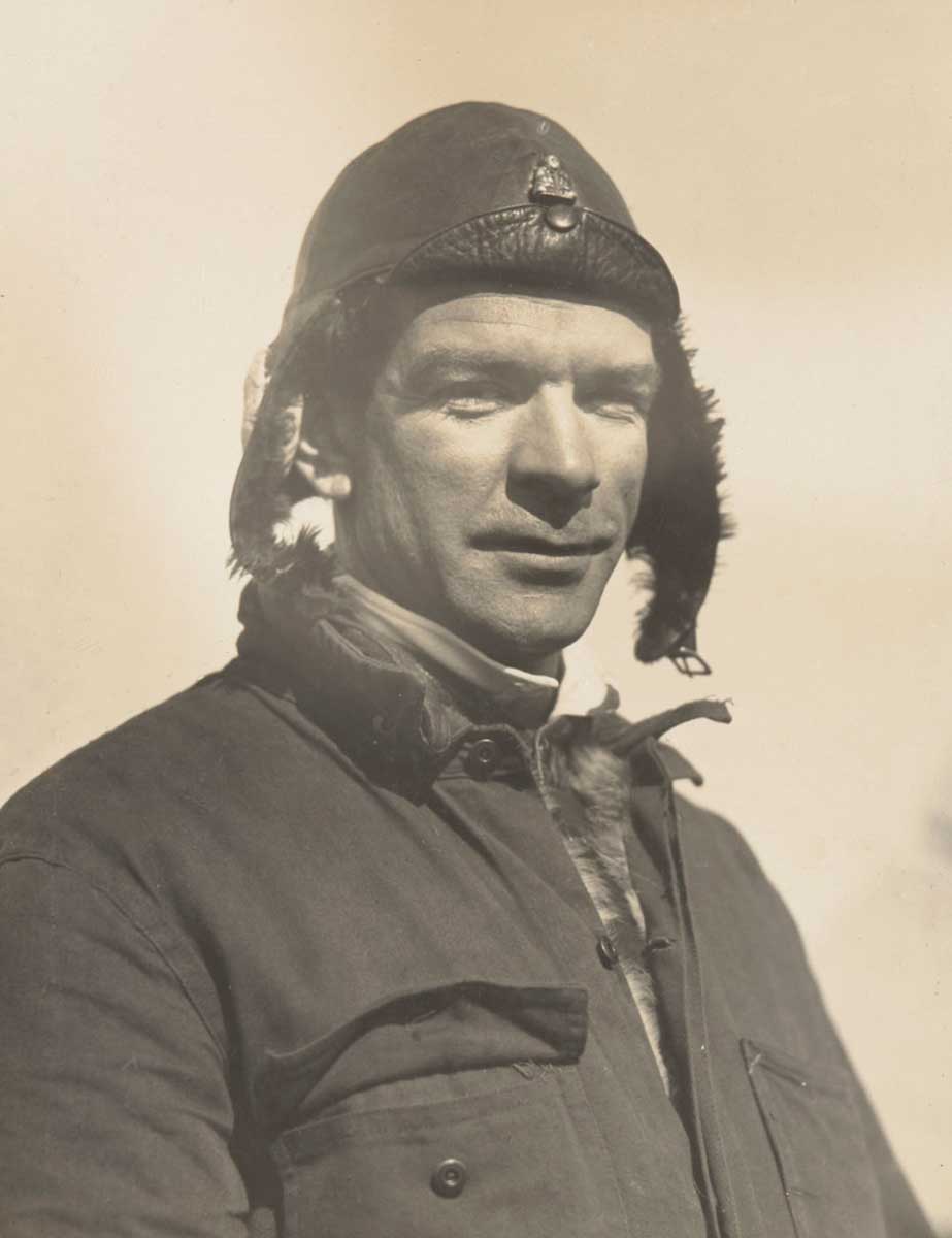 Portrait of Charles Ulm in flying hat.