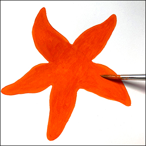 a vibrant illustration of an orange coloured starfish with dark blue outline