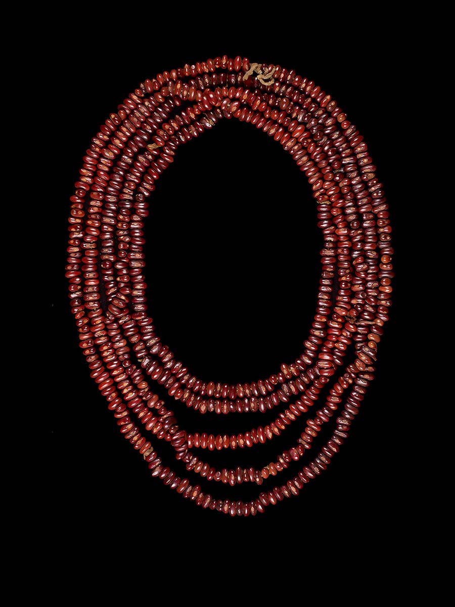 Necklace made of red seeds. - click to view larger image