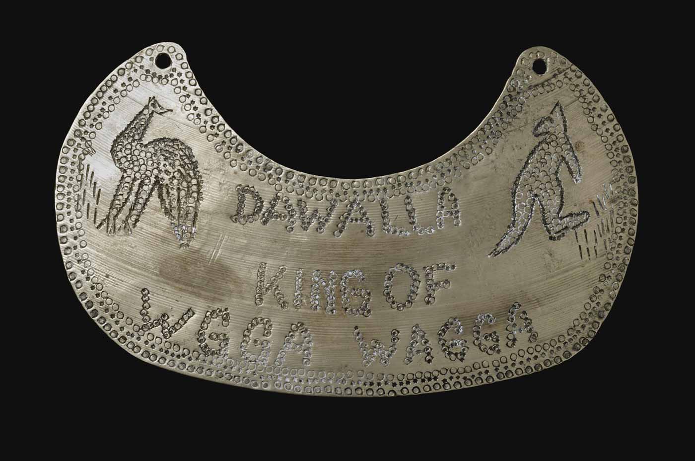 Engraved breastplate with images of a kangaroo and emu and a decorative border. - click to view larger image